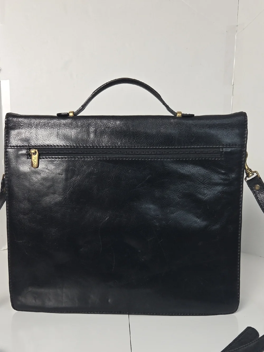 Tumi Full Grain Leather Briefcase Bag in Black With Gold Accent Turnlock
